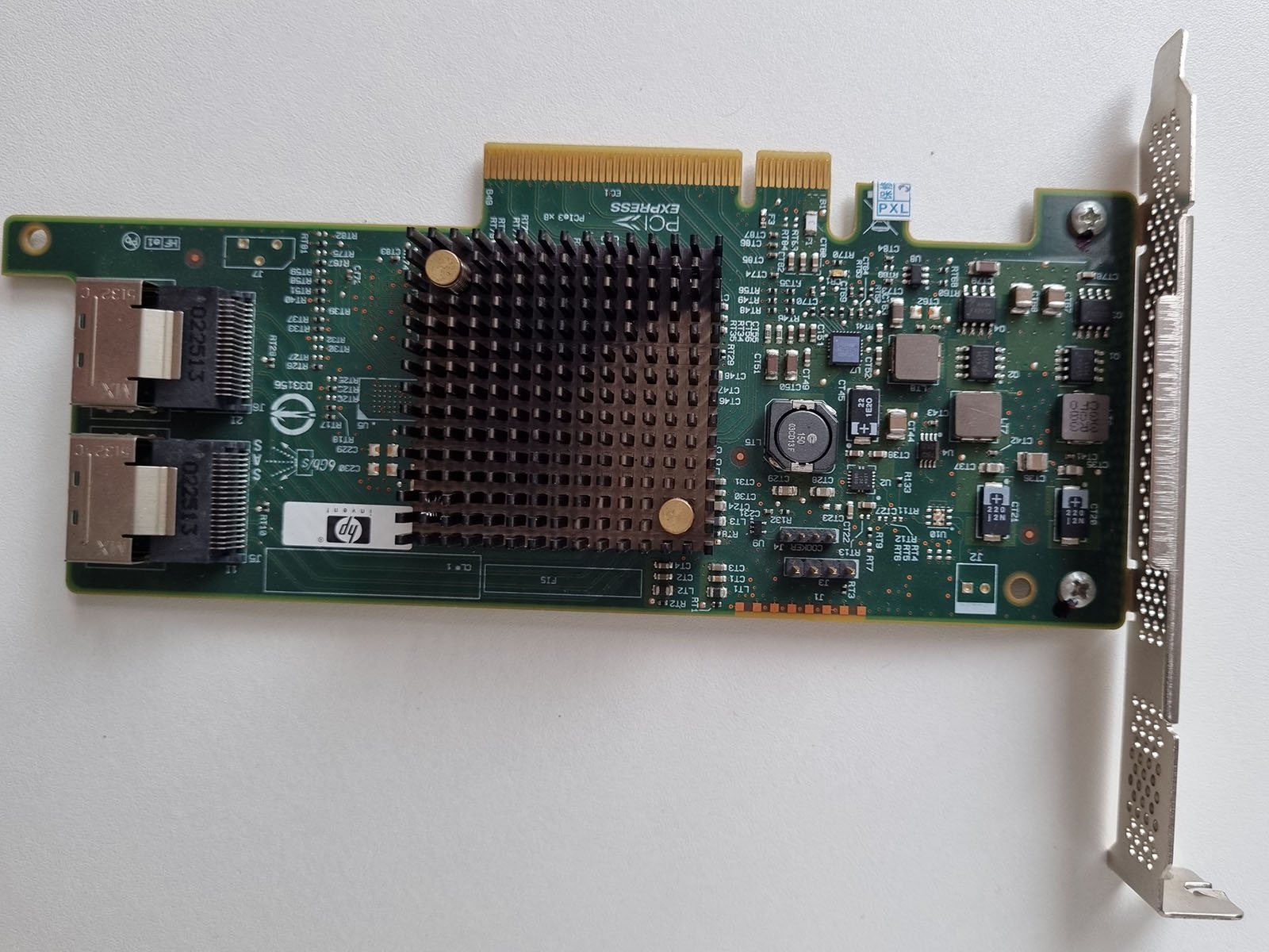 Back of a PCIe SAS RAID/HBA controller card, showing its circuit board, mounting bracket, and SAS connector ports.